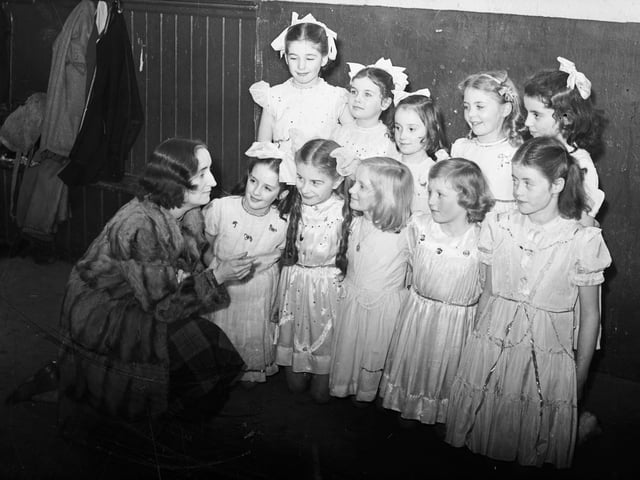 1952... The fairies in the pantomime 'Sinbad the Sailor' which ran at St Patrick's Hall, Spencer Road, receive a final word of advice from their director, Mrs F Fitzpatrick, before taking to the stage. The fairies are, front, from left, Deirdre Friel, Dolores McGilloway, Ursula Fitzpatrick, Irene Cauley and Kathleen Cauley. At back are Josephine Crilly, Roisin Jordan, Josephine Fitzpatrick, Pauline Given and Kathleen Hone.