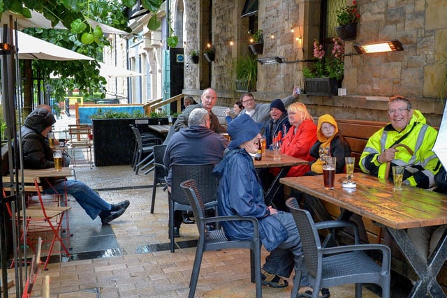 The Guildhall Taphouse has had a facelift recently but the heated outside area remains the same. It's pictured here on a not-so-sunny day DER2027GS – 003