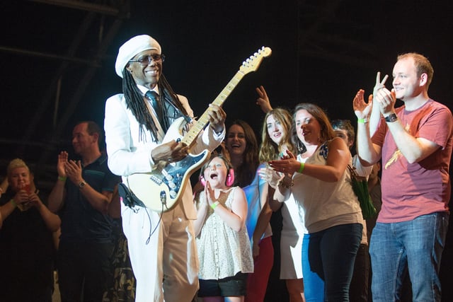 Nile Rodgers with some of the lucky people who joined him on stage in 2013. Picture Martin McKeown. Inpresspics.com.