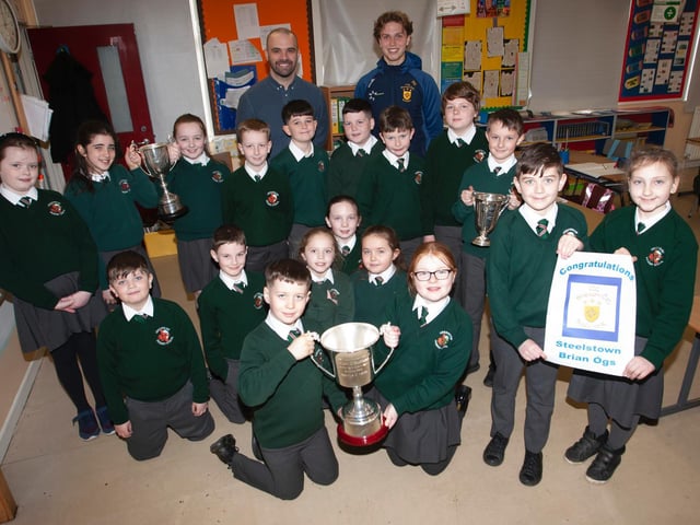 Mr. Smith and his Primary 6 pupils pictured with Donncha Gilmore and the All-Ireland trophy, the Kieran O'Sullivan Cup, at Greenhaw Primary School. (Photo: Jim McCafferty)