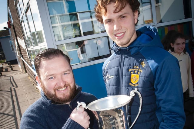 Greenhaw's Mr. Chris Martin pictured with the All-Ireland trophy and Donncha Gilmore, Brian Og's player and school coach.