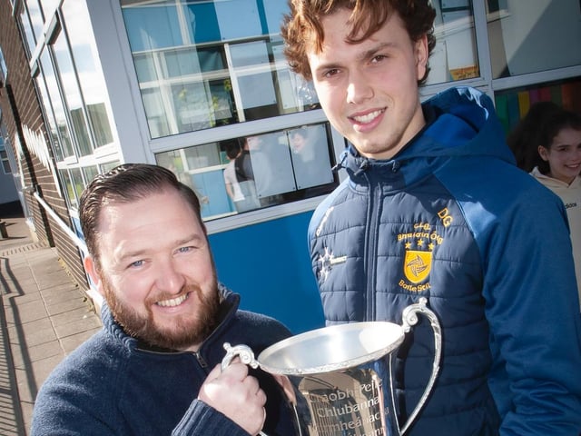 Greenhaw's Mr. Chris Martin pictured with the All-Ireland trophy and Donncha Gilmore, Brian Og's player and school coach.