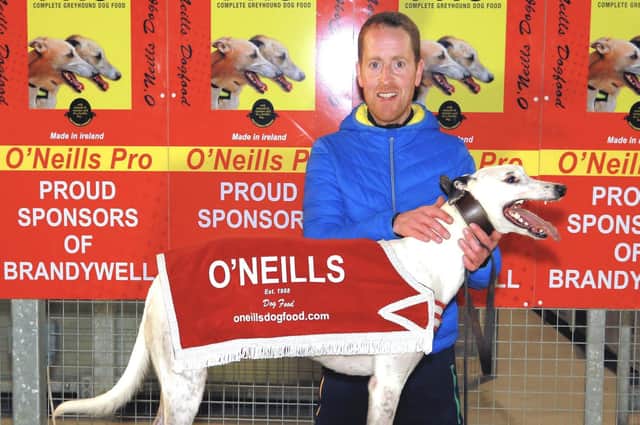 Race six winner at Brandywell Stadium on Monday over 525 yards was 'Costanza' in a time of 29.80. Pictured with winning co-owner, Mr Pius McIntyre.
