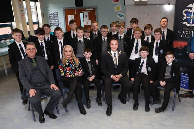 Mayor Graham Warke with Year 8 students at St. Columb's College, who took part in the "Emotions Matters" event held in St. Columb's College. Seated, on left, are Brian Keys, vice-principal, Fiona Condren, founder of Emotions Matters and standing on right is Danny Quigley, tri-athlete and fundraiser.  (Photo - Tom Heaney, nwpresspics)