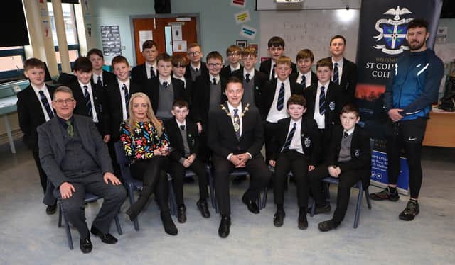Mayor Graham Warke with Year 8 students at St. Columb's College, who took part in the "Emotions Matters" event held in St. Columb's College. Seated, on left, are Brian Keys, vice-principal, Fiona Condren, founder of Emotions Matters and standing on right is Danny Quigley, tri-athlete and fundraiser. (Photo - Tom Heaney, nwpresspics)