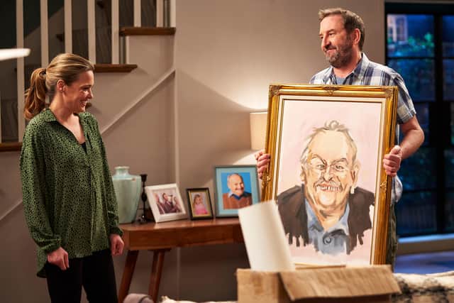 Lee and Lucy with the painting of Frank