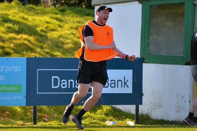 City of Derry's Head coach Richard Carter celebrates his side's crucial win over Sundays well. (Photo: George Sweeney)