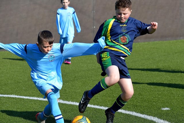 St Catherine’s Primary School battle it out with Long Tower Primary School in the Ryan McBride Schools Cup competition. Picture by George Sweeney