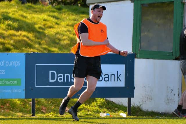 GET IN! . . .City of Derry's Head coach Richard Carter celebrates his side's crucial win over Sundays well at Judges Road on Saturday. (Photo: George Sweeney)