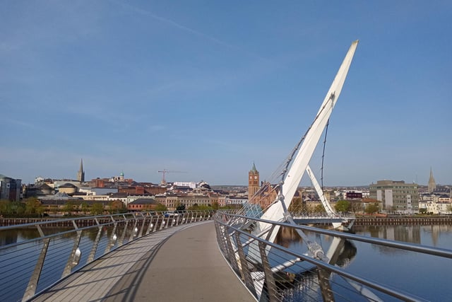 Derry's Peace Bridge and historic city centre.