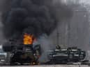 Russian personnel carriers in flames in Kiev.