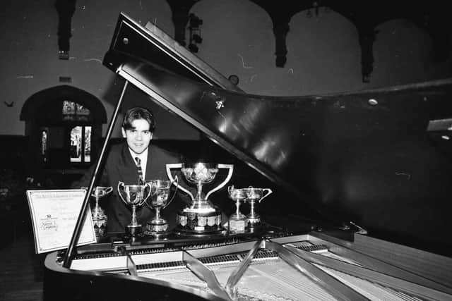 Concert pianist Cathal Breslin with an array of the prizes he won whilst competing at the feis.