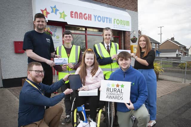WELL DONE MISCHA! - The Housing Executive's Matthew McCay presents 14 years-old Mischa Tracey with her prize, a new Apple iPad, for winning the Young Rural Volunteer Award 2021 at Enagh Youth Forum, Strathfoyle, Derry on Thursday afternoon last. Mischa is the first winner of the new category aimed at young people. Included at front is David Lavery. Back from left are Michael Cooke, Housing Executive, Kaid Callaghan, Holly Hunter and Zara Doherty.


The competition gave rural communities and their local groups  the chance to showcase the range of activities they are involved with, helping to keep their areas vibrant and attractive places to live. Included kneeling at front from left are Oliver Wroniak, Kaid Callaghan, Zara Doherty and Patrick Dixon. Standing back from left, Paul Hughes, David Lavery, Matthew McCay, Rural and Regeneration Unit, Housing Executive, Holly Hunter, Eamon Oâ€TMDonnell and Claire Tracey. (Photos: Jim McCafferty Photography)