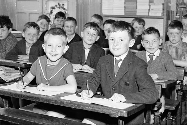 June 1964. In his classroom at St Eugene's Infants' School in Francis Street is seven years old Gerard White, of Marlborough Road, who was awarded one of 50 special prizes in a national handwriting test.