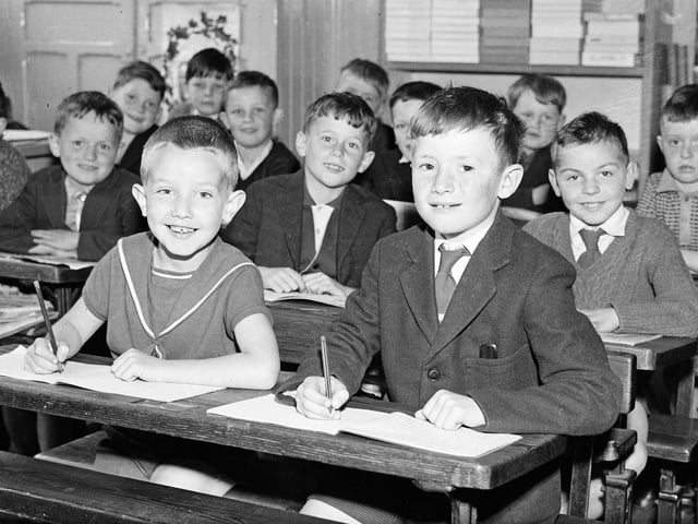 June 1964. In his classroom at St Eugene's Infants' School in Francis Street is seven years old Gerard White, of Marlborough Road, who was awarded one of 50 special prizes in a national handwriting test.