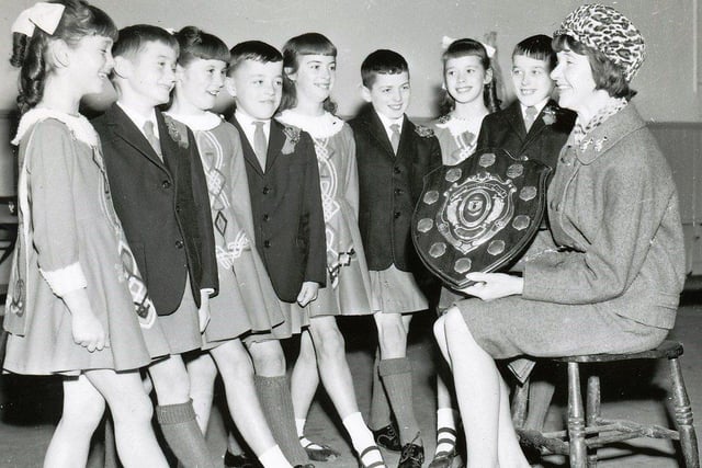 Nov 1966. Mrs. Mary O'Doherty with the team from the McLaughlin School of Dancing, Derry, which won the junior figure dancing championships of Ulster. From left, Catherine Toland, Peter Griffin, Carol McClintock, Patrick McGlinchey, Maura Carey, Dave Higgins, Hilary Kelly and Liam McClintock. The group was youngest ever to win the title.
