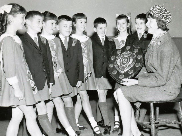 Nov 1966. Mrs. Mary O'Doherty with the team from the McLaughlin School of Dancing, Derry, which won the junior figure dancing championships of Ulster. From left, Catherine Toland, Peter Griffin, Carol McClintock, Patrick McGlinchey, Maura Carey, Dave Higgins, Hilary Kelly and Liam McClintock. The group was youngest ever to win the title.
