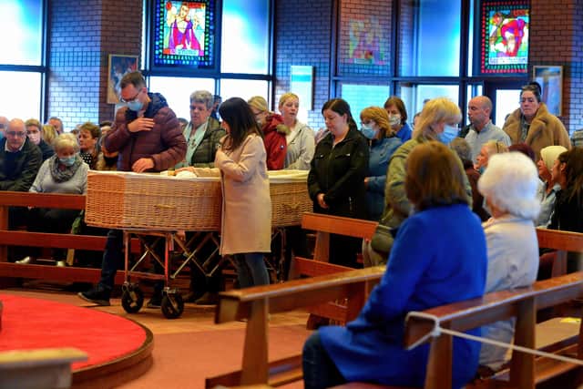 A large number of local people paid their respect at the coffin of Ballymagroarty Parish Priest Fr. Paddy O’Kane in Holy Family Church on Tuesday evening. Photograph: George Sweeney / Derry Journal. DER2213GS – 004