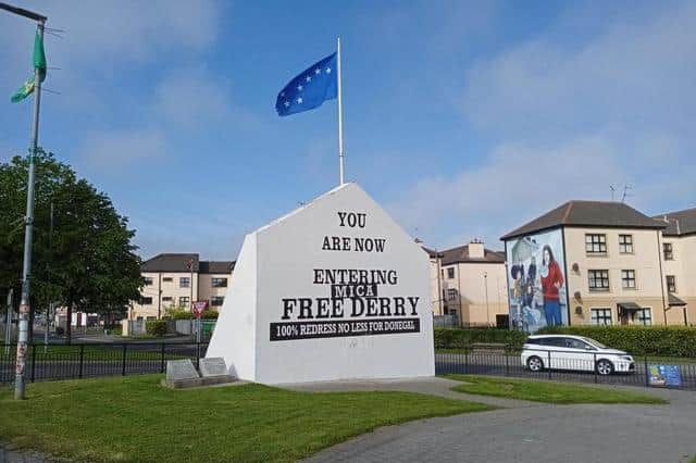A slogan of support for mica-affected families in Donegal at Free Derry corner.