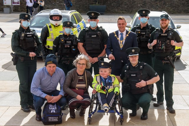 Jack Beattie from Donegal who has Osteogenesis Imperfacta or Brittle Bone Disease pictured during a reception held for him with his mum and dad, Kevin and Ruth, by Alderman Graham Warke, Mayor of Derry City and Strabane District Council. The honorary Garda also met with members of the PSNI who presented him with a certificate of recognition and the PSNI crest. Jack also made his first arrest in the North when he put the handcuffs on his dad Kevin.  Picture Martin McKeown. 30.03.22