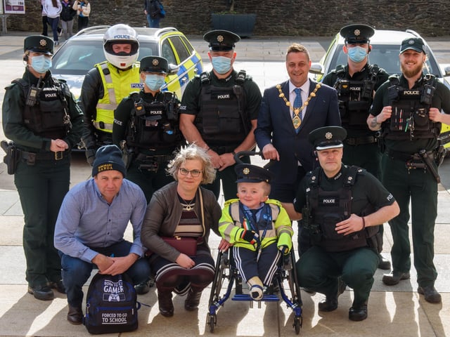 Jack Beattie from Donegal who has Osteogenesis Imperfacta or Brittle Bone Disease pictured during a reception held for him with his mum and dad, Kevin and Ruth, by Alderman Graham Warke, Mayor of Derry City and Strabane District Council. The honorary Garda also met with members of the PSNI who presented him with a certificate of recognition and the PSNI crest. Jack also made his first arrest in the North when he put the handcuffs on his dad Kevin.  Picture Martin McKeown. 30.03.22
