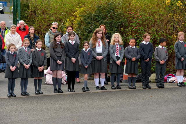 Local schools form a guard of honour outside Holy Family Church after Requiem Mass for Fr Paddy OKane on Thursday afternoon. Photograph: George Sweeney / Derry Journal. DER2213GS  040
