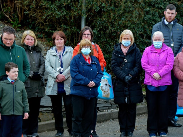 Local people outside Holy Family Church after Requiem Mass for Fr Paddy OKane on Thursday afternoon. Photograph: George Sweeney / Derry Journal. DER2213GS 041