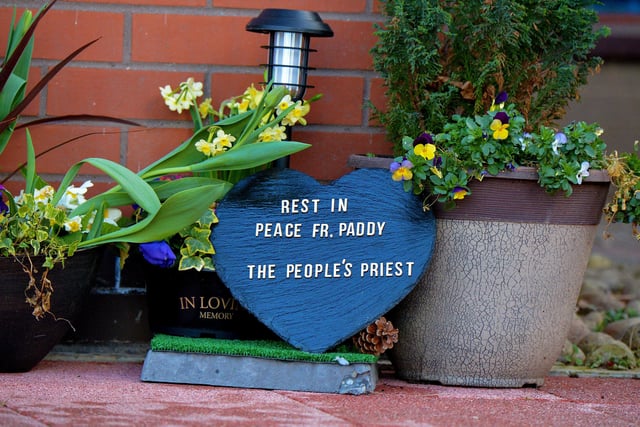 A memorial to Fr Paddy OKane, placed outside Holy Family Church by a parishioner. Photograph: George Sweeney / Derry Journal. DER2213GS  044