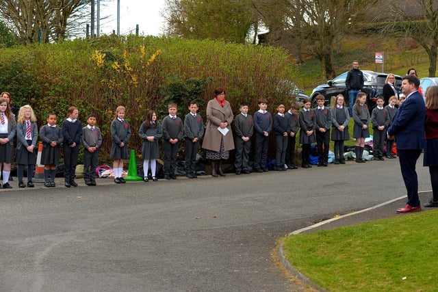 Local schools form a guard of honour outside Holy Family Church after Requiem Mass for Fr Paddy OKane on Thursday afternoon. Photograph: George Sweeney / Derry Journal. DER2213GS  039