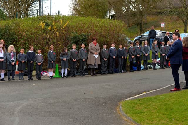 Local schools form a guard of honour outside Holy Family Church after Requiem Mass for Fr Paddy OKane. Photograph: George Sweeney / Derry Journal. DER2213GS  039