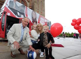 Derry legend: Pictured at the Foyle Legends bus unveiling in Guildhall Square back in 2017 were Phil Coulter, James McClean's wife Erin McClean and James McClean's children, Allie-Mae and Junior McClean.