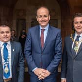 An Taoiseach Micheál Martin at the Guildhall with, on left, Councillor Martin McDermott, An Leas-Cathaoirleach of Donegal County Council and Alderman Graham Warke, Mayor, Derry & Strabane Council.