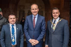An Taoiseach Micheál Martin at the Guildhall with, on left, Councillor Martin McDermott, An Leas-Cathaoirleach of Donegal County Council and Alderman Graham Warke, Mayor, Derry & Strabane Council.