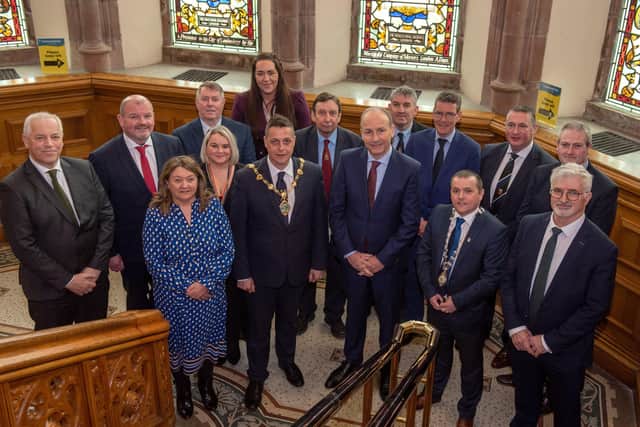 An Taoiseach Micheal Martin is welcomed to the Guildhall by Alderman Graham Warke, Mayor of Derry City and Strabane District Council and Councillor Martin McDermott, Leas Cathaoirleach, Donegal County Council and members of the North West Regional Development Group. Picture Martin McKeown. 01.04.22