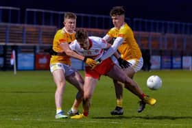 Charlie Diamond battles for the ball with Antrim's Sean Duffin and Cahir Donnelly. The Bellaghy man scored 6 frees in Derry's 0-12 to 0-9 win in Owenbeg on Friday evening. (Photo: George Sweeney)
