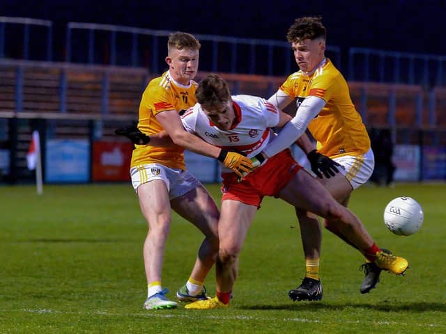 Charlie Diamond battles for the ball with Antrim's Sean Duffin and Cahir Donnelly. The Bellaghy man scored 6 frees in Derry's 0-12 to 0-9 win in Owenbeg on Friday evening. (Photo: George Sweeney)