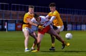 Charlie Diamond battles for the ball with Antrim's Sean Duffin and Cahir Donnelly. The Bellaghy man scored 6 frees in Derry's 0-12 to 0-9 win in Owenbeg on Friday evening. (Photo: George Sweeney)