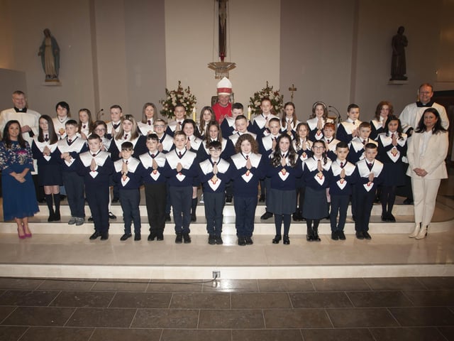 HOLY CHILD PS CONFIRMATION. . . . .The Bishop of Derry Dr. Donal McKeown pictured with pupils from Holy Child Primary School who received the Sacrament of Confirmation at St. Maryâ€TMs Church, Creggan on Friday last. Included are Fr. Daniel McFaul and Fr. Joe Gormley, and Mrs. Pat Concannon, Vice Principal and Mrs. Aine Oâ€TMConnor, Senior teacher. (Photo: Jim McCafferty Photography)