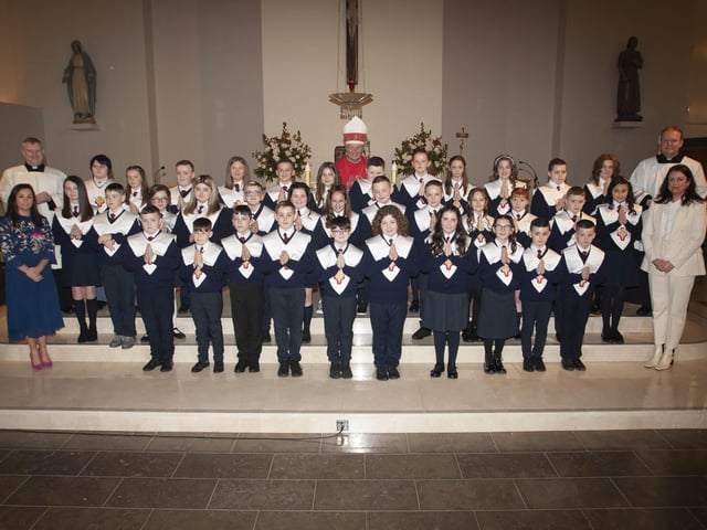 HOLY CHILD PS CONFIRMATION. . . . .The Bishop of Derry Dr. Donal McKeown pictured with pupils from Holy Child Primary School who received the Sacrament of Confirmation at St. Maryâ€TMs Church, Creggan on Friday last. Included are Fr. Daniel McFaul and Fr. Joe Gormley, and Mrs. Pat Concannon, Vice Principal and Mrs. Aine Oâ€TMConnor, Senior teacher. (Photo: Jim McCafferty Photography)