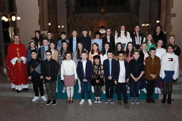 Children from St. Anneâ€TMs Primary School who received the Sacrament of Confirmation from Fr. Paul Farren at St. Eugeneâ€TMs Cathedral on Thursday. Included in photo are Mrs. Eilis McGuinness, Principal and Mrs. Suzanne McRory, class teacher. (Photo: Jim McCafferty Photography)