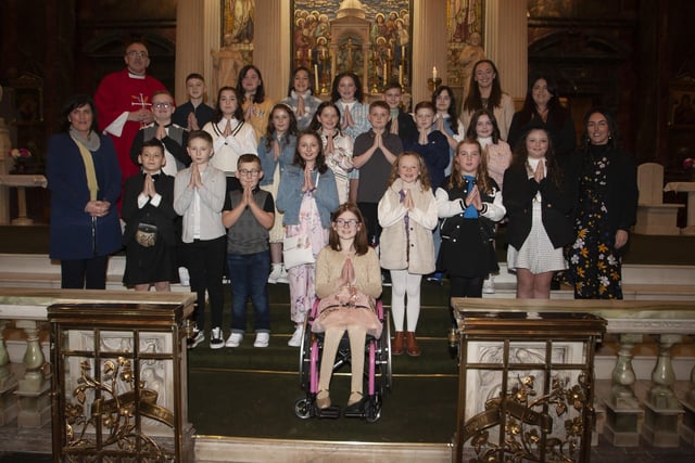Children from Long Tower Primary School who received the Sacrament of Confirmation from Fr. Paddy Baker on Thursday last at St. Columbaâ€TMs Church, Long Tower. Included in photo are Mrs. Joyce Logue, Principal, Mrs McGovern Teacher; Miss Callaghan, Classroom Assistant; and Mrs Deery, Classroom Assistant. (Photo: Jim McCafferty Photography)