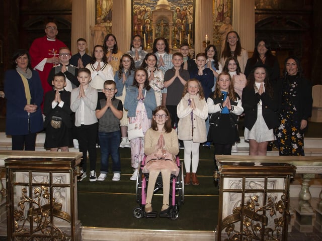 Children from Long Tower Primary School who received the Sacrament of Confirmation from Fr. Paddy Baker on Thursday last at St. Columbaâ€TMs Church, Long Tower. Included in photo are Mrs. Joyce Logue, Principal, Mrs McGovern Teacher; Miss Callaghan, Classroom Assistant; and Mrs Deery, Classroom Assistant. (Photo: Jim McCafferty Photography)