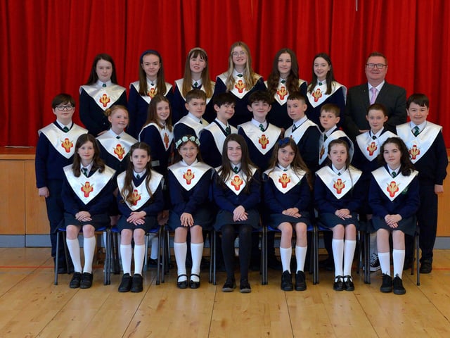 Mr Bradley pictured with his P7 class from St Patrick’s Primary School who were confirmed by Fr McDermott in St Patrick’s Church, Pennyburn, on Tuesday 15th March last. Photo: George Sweeney.  DER2211GS – 024