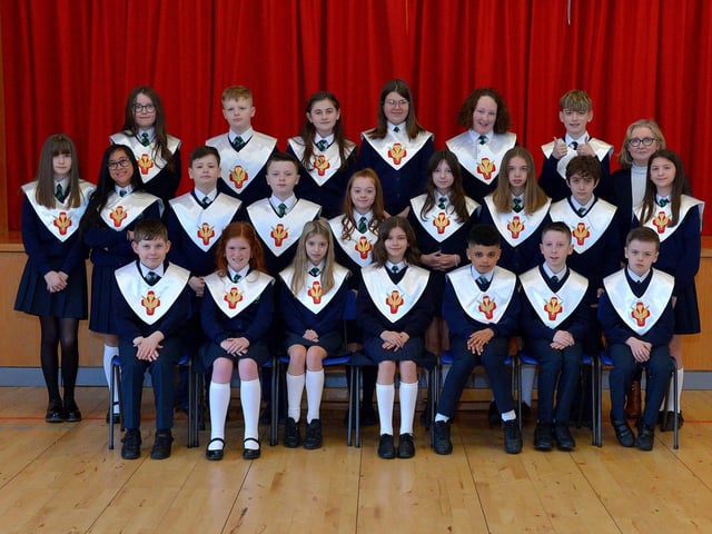 Mrs Moore pictured with her P7 class from St Patrick’s Primary School who were confirmed by Fr McDermott in St Patrick’s Church, Pennyburn, on Tuesday 15th March last. Photo: George Sweeney.  DER2211GS – 025