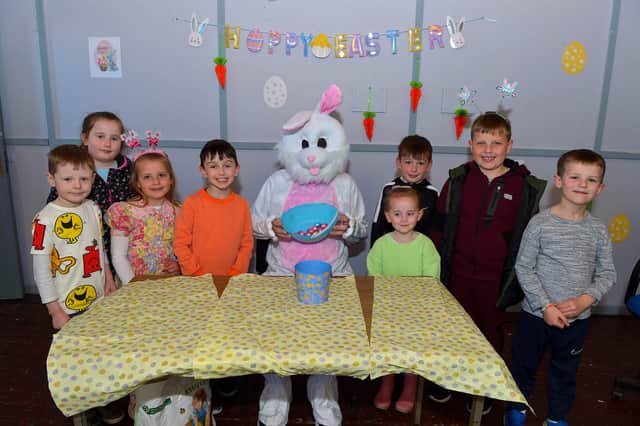 Children pictured with the Easter Bunny at the Muff Spring and Easter Fair at St Mary’s Hall on Saturday afternoon last. DER2213GS – 084