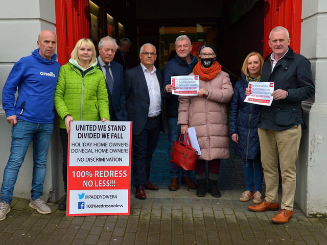 Panellists and contributors at the John Hume Foundation’s ‘Building Common Ground’ event held in the Playhouse, Artillery Street, show solidarity with MICA protesters who demonstrated outside the venue when Taoiseach Micheál Martin arrived. Photo: George Sweeney. DER2213GS – 053