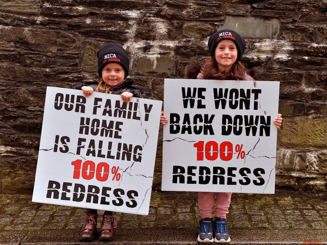 Aairah and Anayah Duggan, from Redcastle, at the MICA protest outside the Playhouse, in Artillery Street, on Friday evening last, during a visit by Taoiseach Micheál Martin to a John Hume Foundation event in the venue. Photo: George Sweeney. DER2213GS – 054