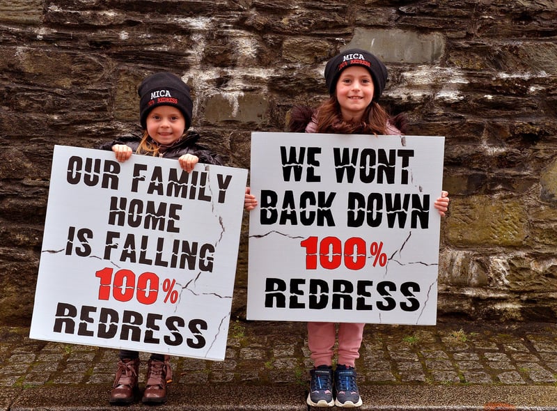 Aairah and Anayah Duggan, from Redcastle, at the MICA protest outside the Playhouse, in Artillery Street, on Friday evening last, during a visit by Taoiseach Micheál Martin to a John Hume Foundation event in the venue. Photo: George Sweeney.  DER2213GS – 054