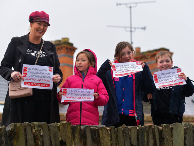 A family at the MICA protest outside the Playhouse, in Artillery Street, on Friday evening last, during a visit by Taoiseach Micheál Martin to a John Hume Foundation event in the venue. Photo: George Sweeney. DER2213GS – 056