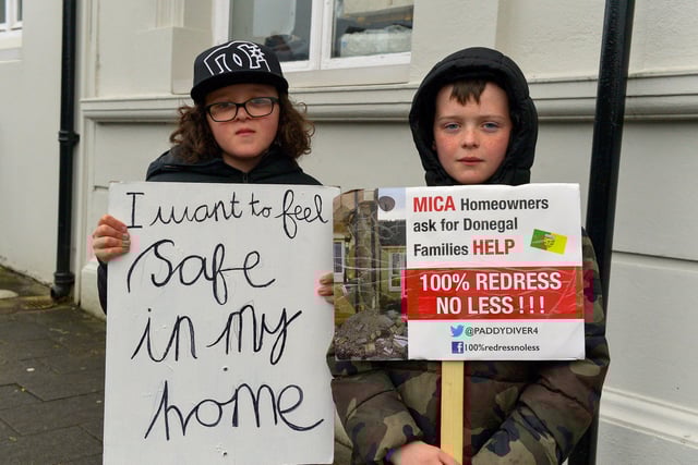 Zak and Ethan McDonnell, from Ramelton, at the MICA protest outside the Playhouse, in Artillery Street, on Friday evening last, during a visit by Taoiseach Micheál Martin to a John Hume Foundation event in the venue. Photo: George Sweeney. DER2213GS – 057